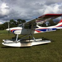 Skylane 14 on floats-grass